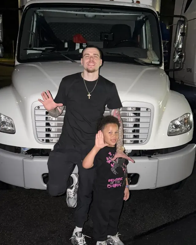 Anthony Schulz with his son in front of his box truck